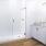 bathroom with a large mirror and ample lighting