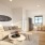 living room with connection to the kitchen and with bright lighting from large windows