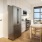 kitchen area with large amounts of counter-space and with a dining table and chairs located inside of the kitchen